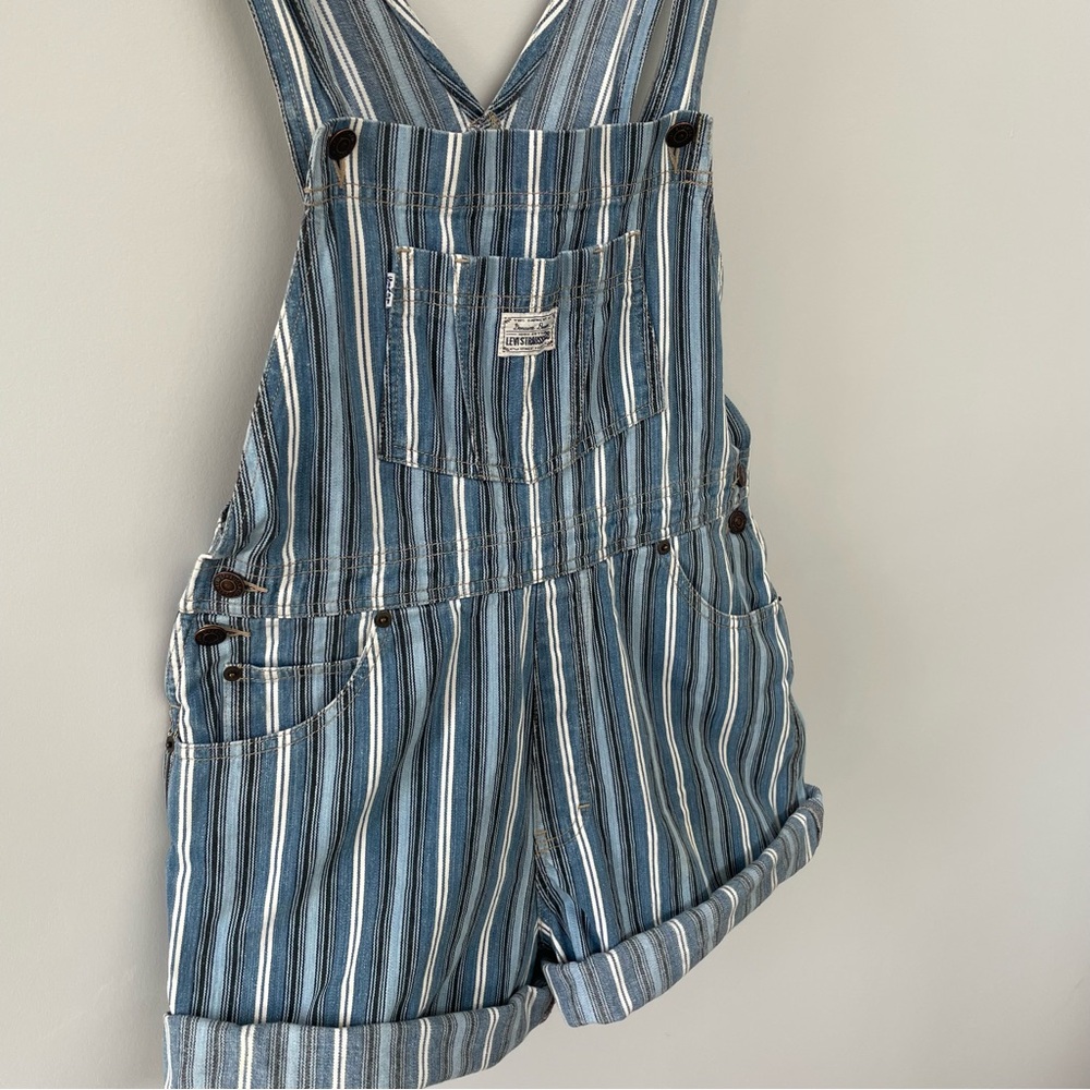 Blue and white striped Levi’s overall shorts